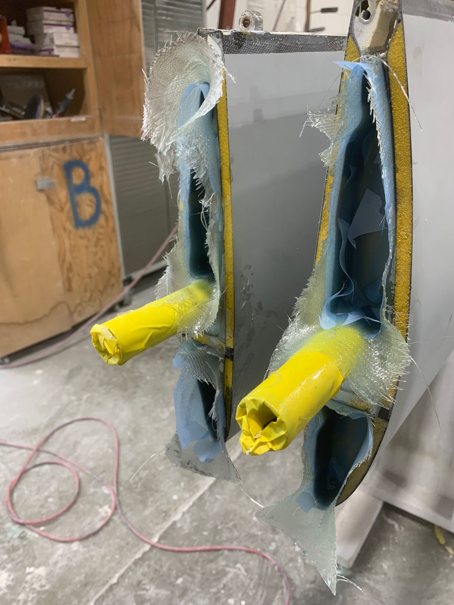 The letter b is on a wooden cabinet