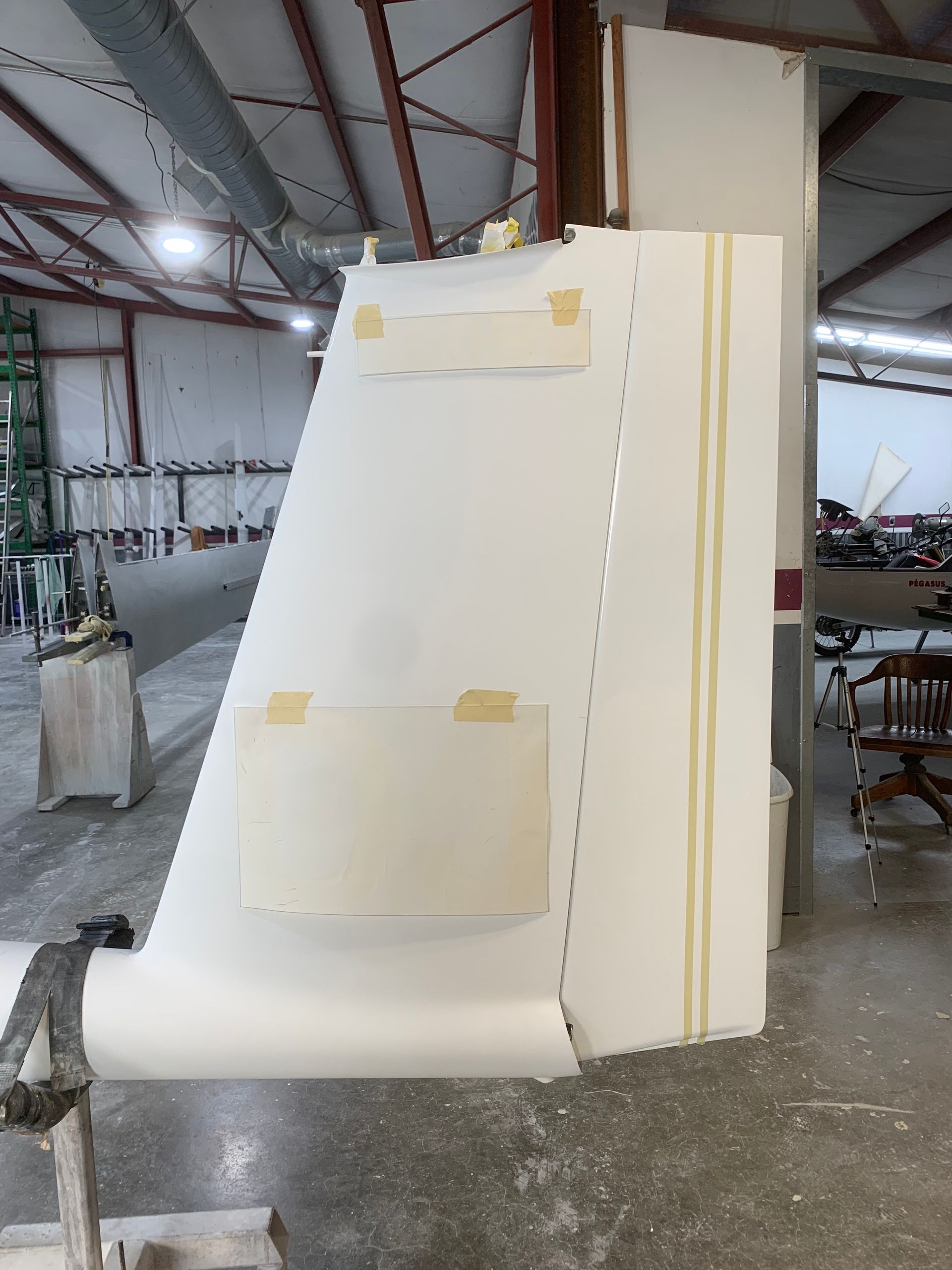 A large piece of foam is sitting on a table in a warehouse