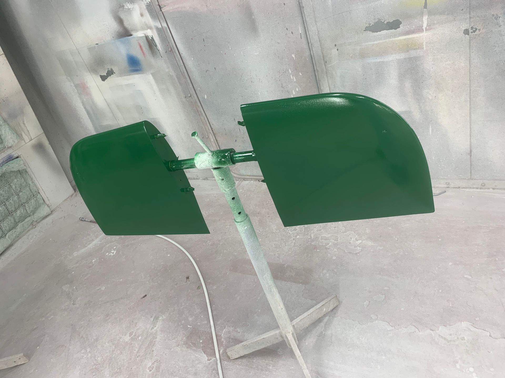 A green object is sitting on a stand in a room.