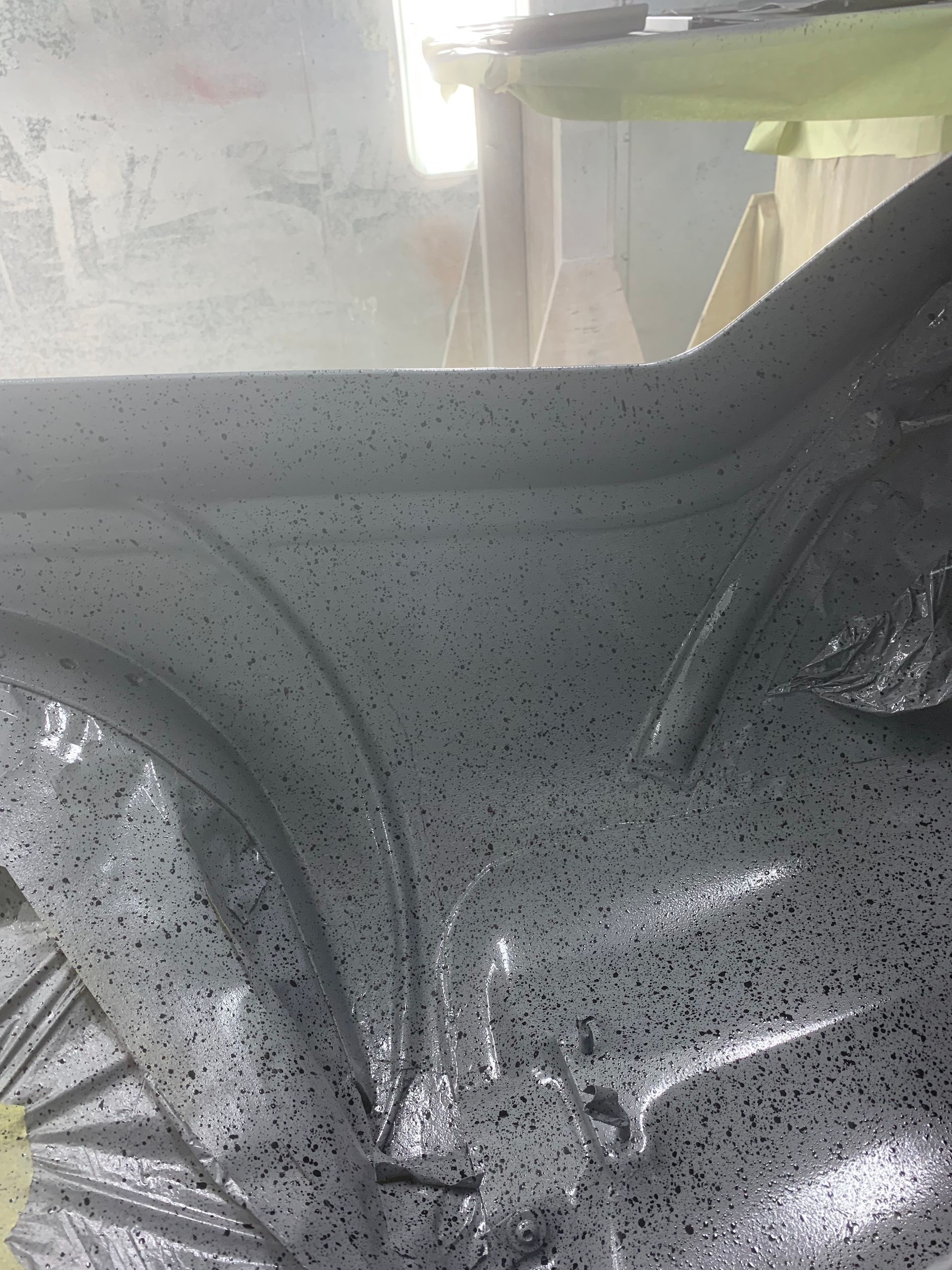 A close up of a car with a lot of paint on it.