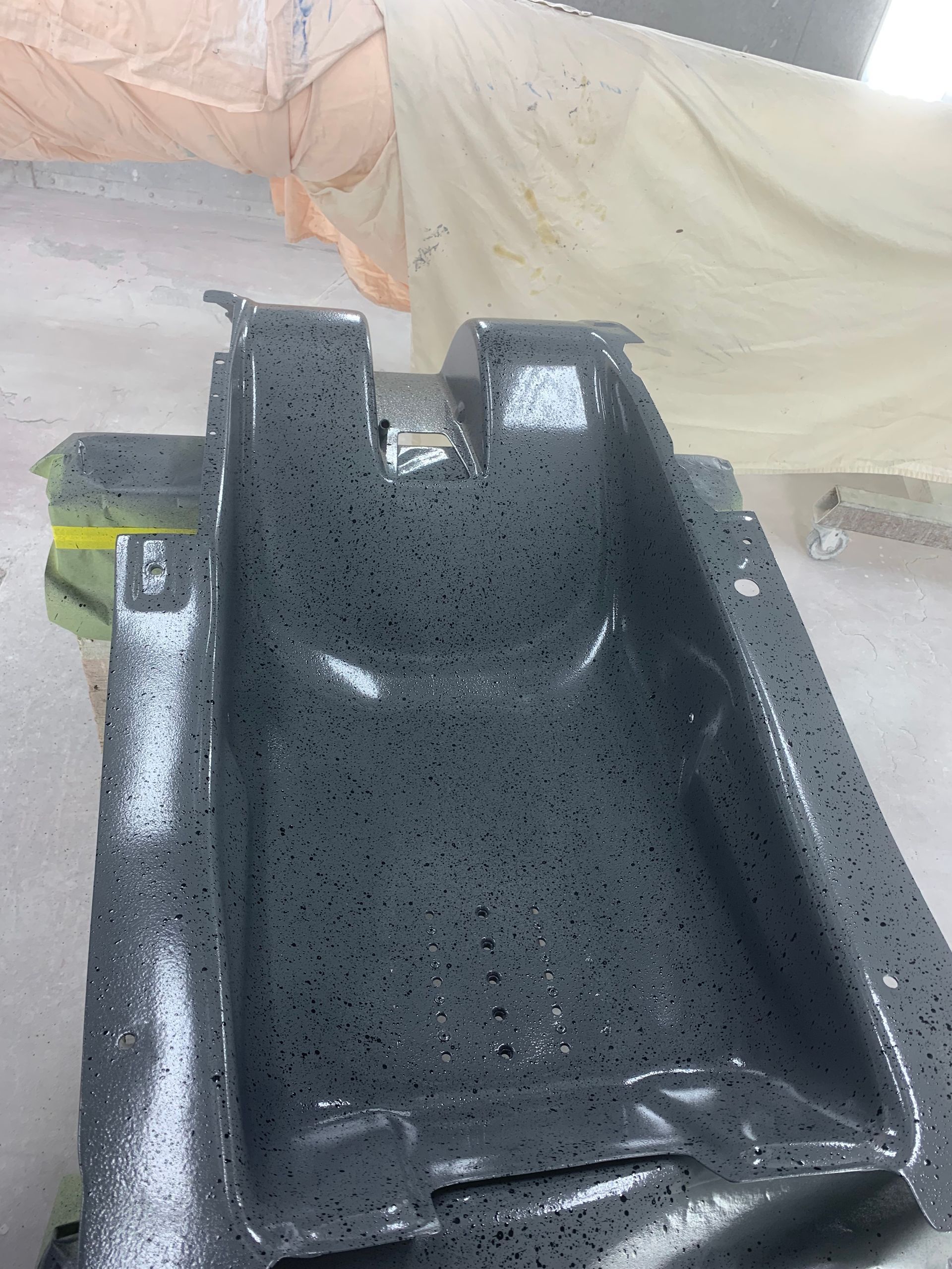 A black object with white dots on it is sitting on a table.