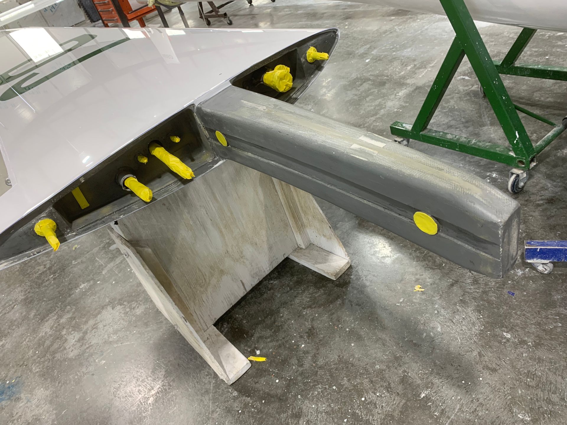 A piece of metal is sitting on top of a wooden table.