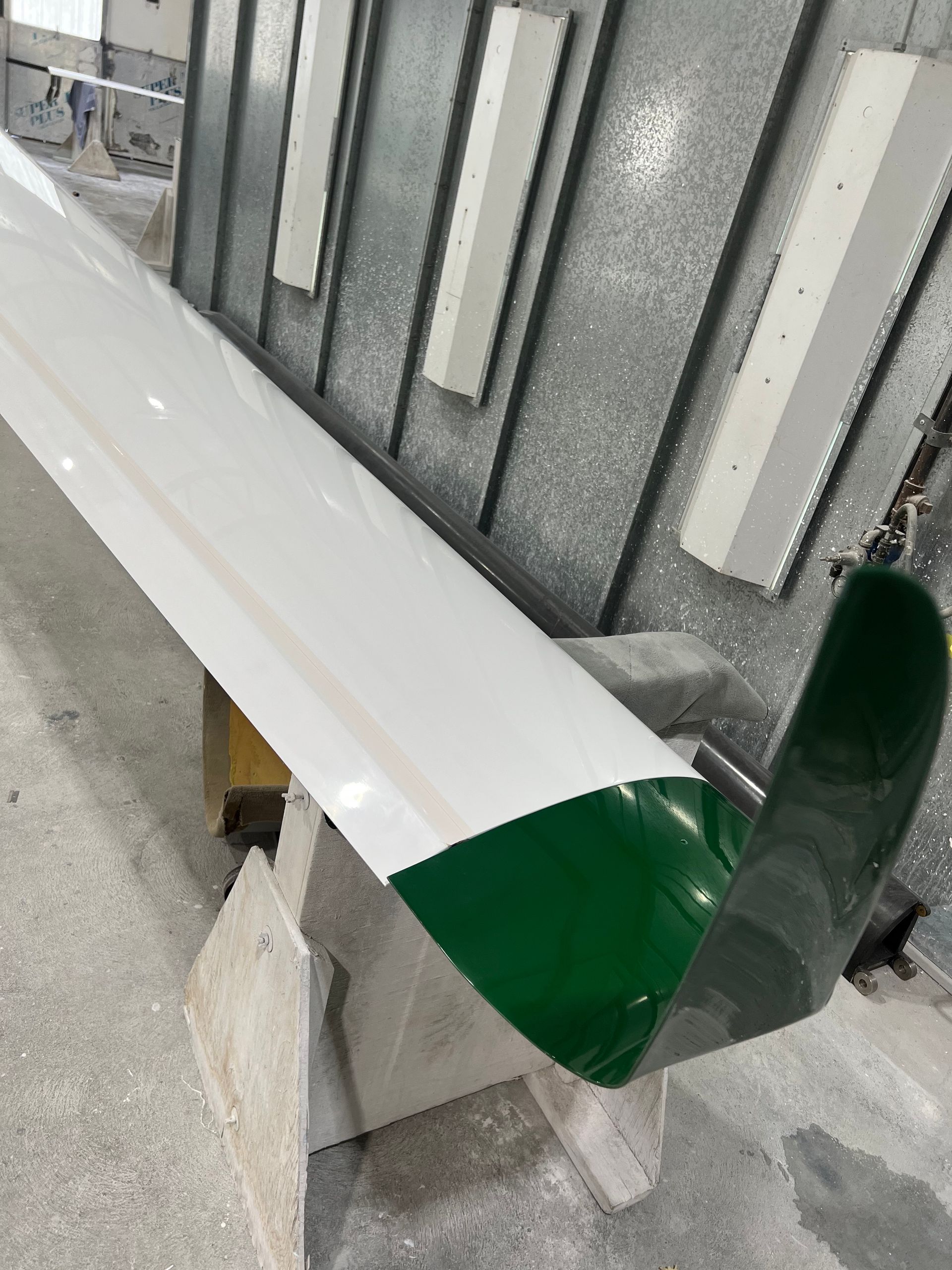 A green and white object is sitting on a table