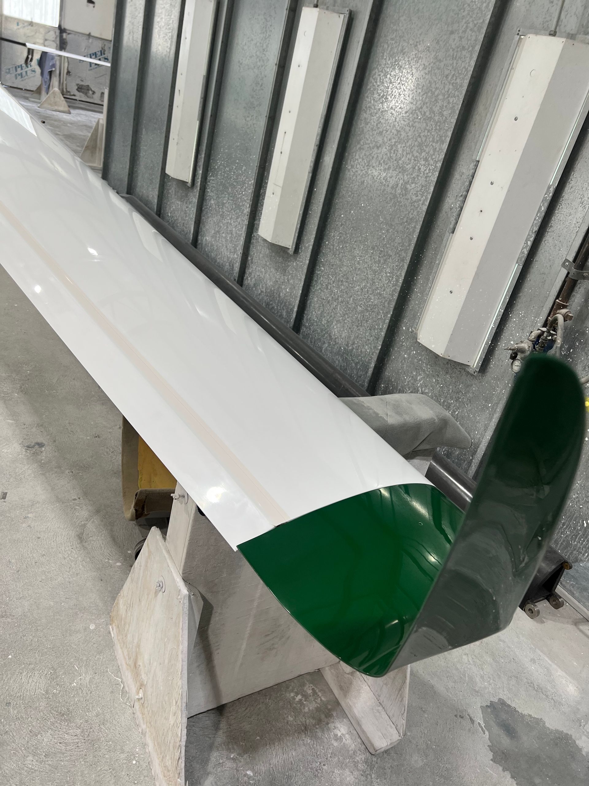 A green and white object is sitting on a table