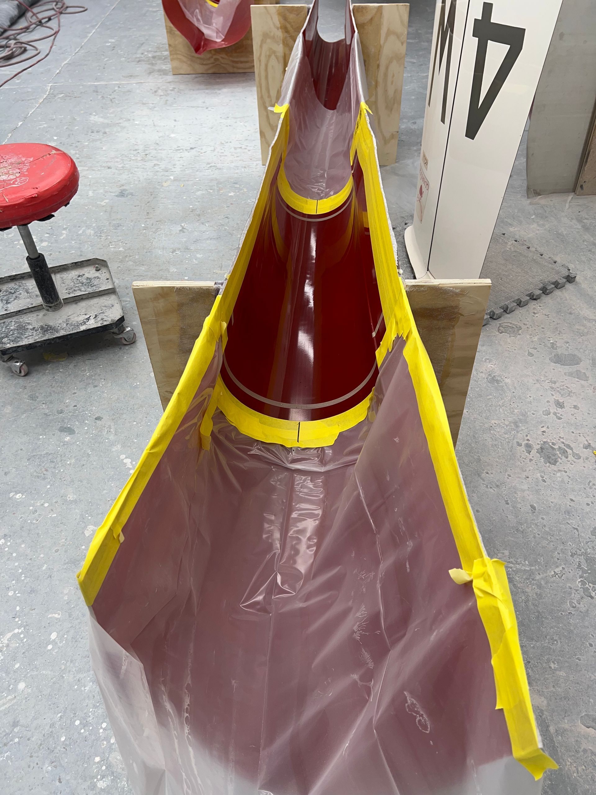 A red cone with a yellow stripe on it
