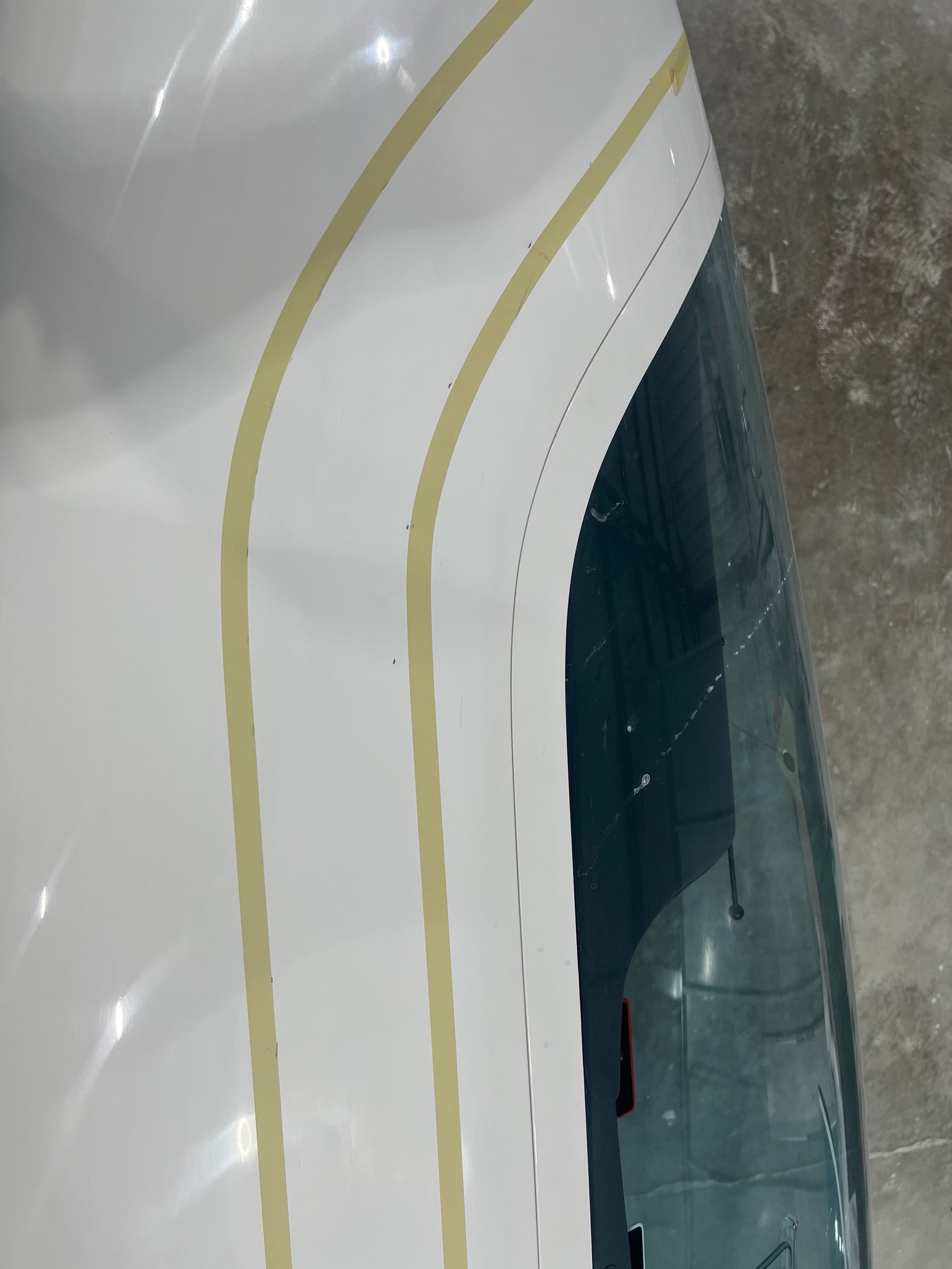 A close up of a white object with yellow stripes on it