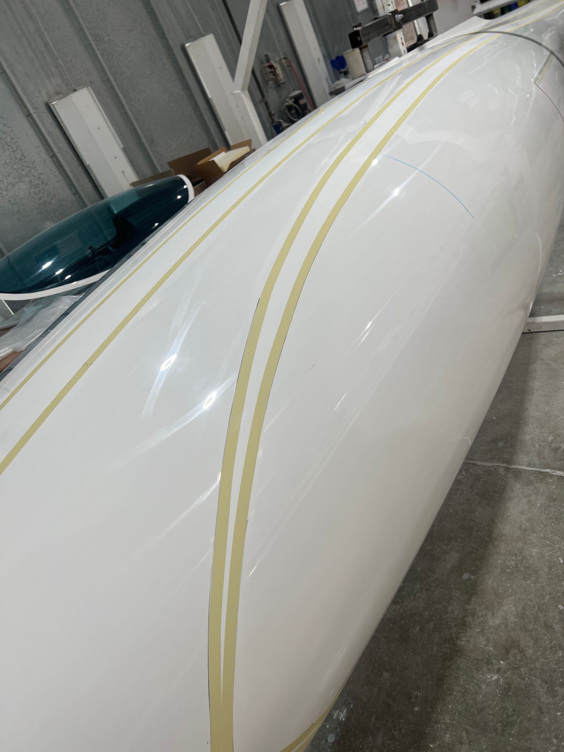 A large white object is sitting on the floor in a room.