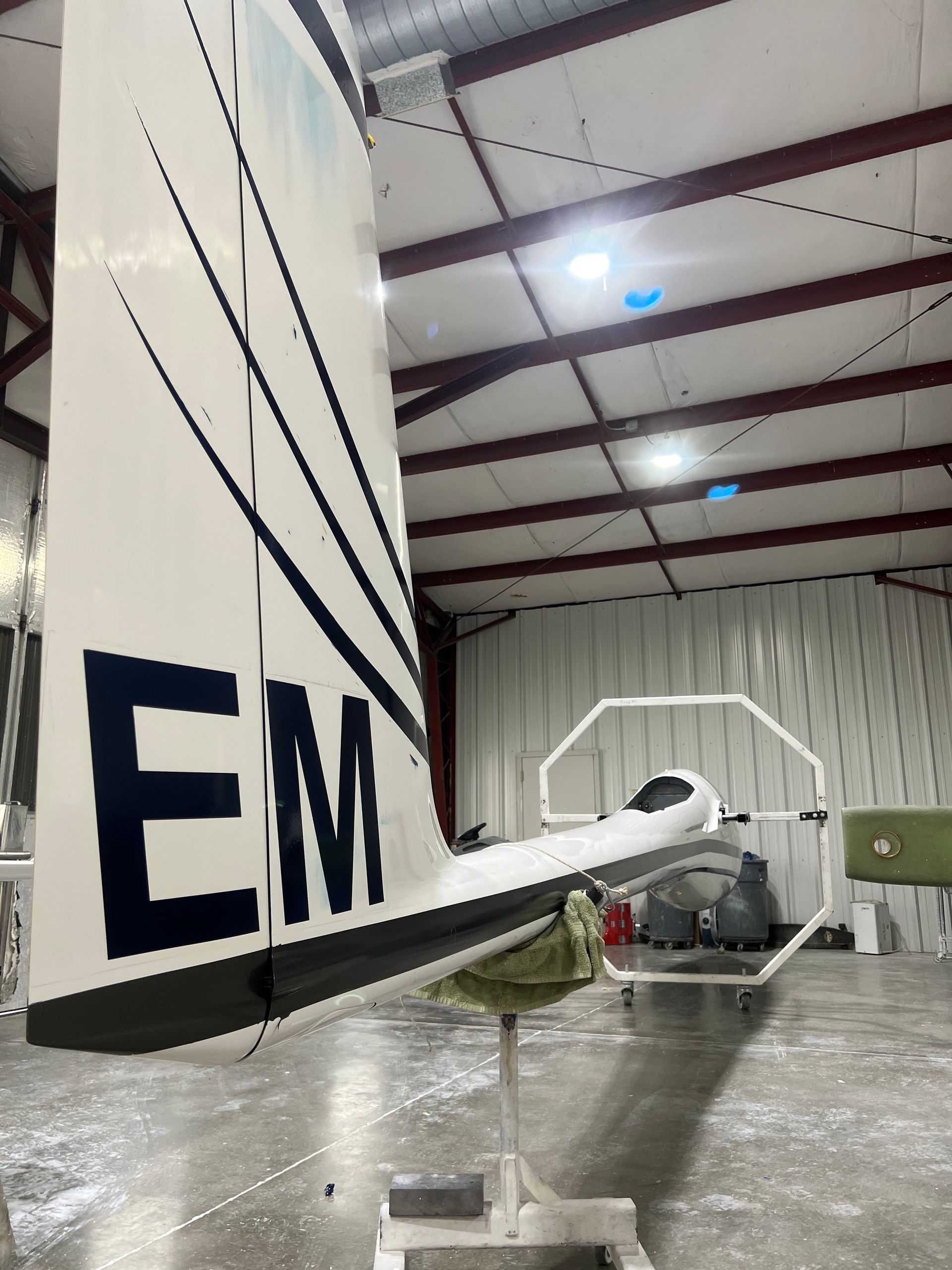 A plane with the letters em on the tail