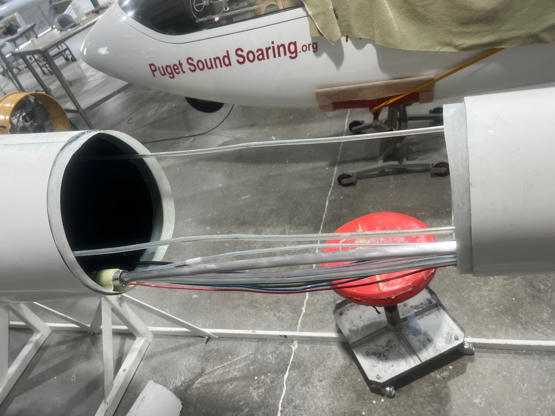 A plane that says project sound soaring on it