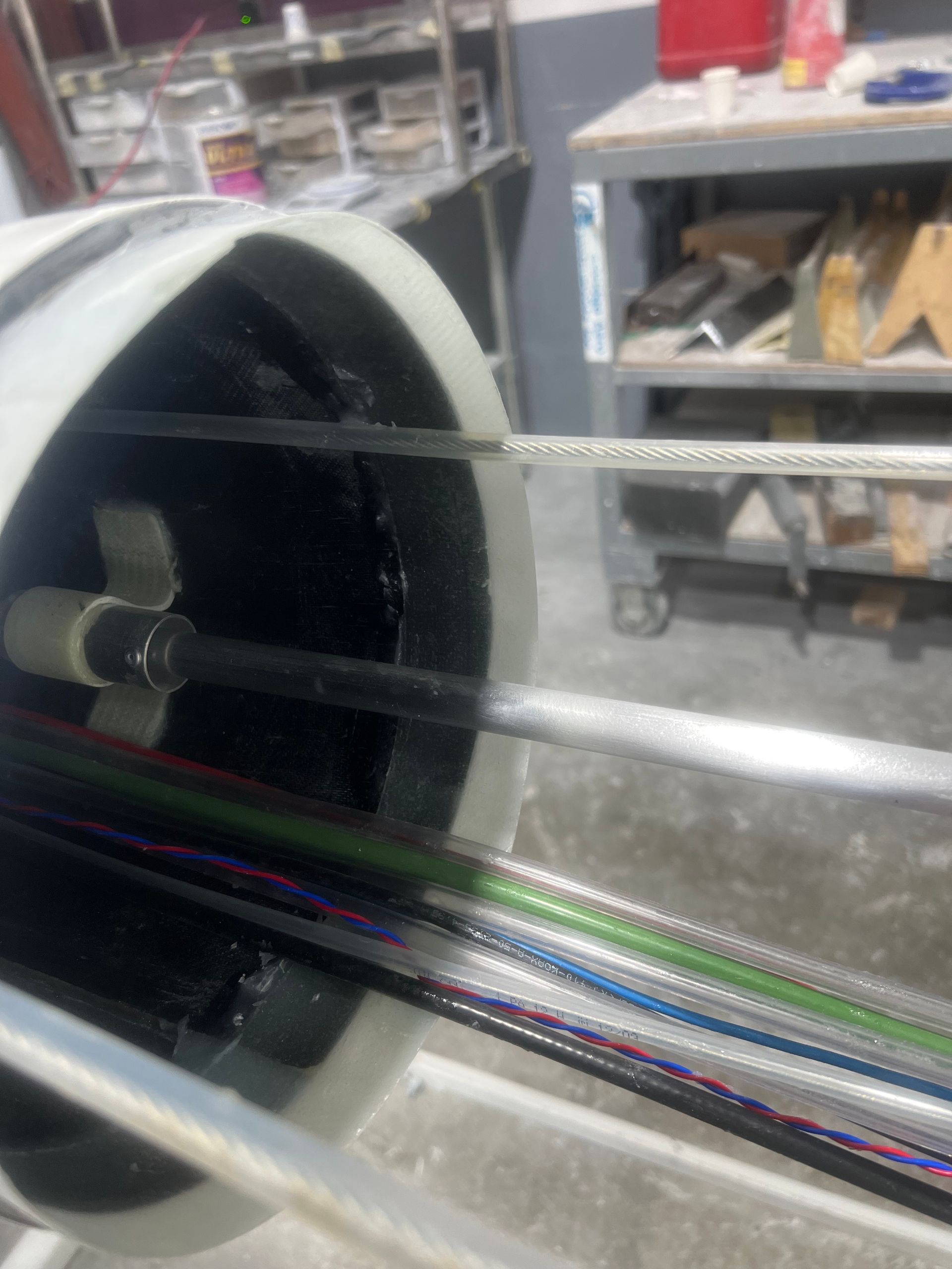 A close up of a tube with a propeller inside of it