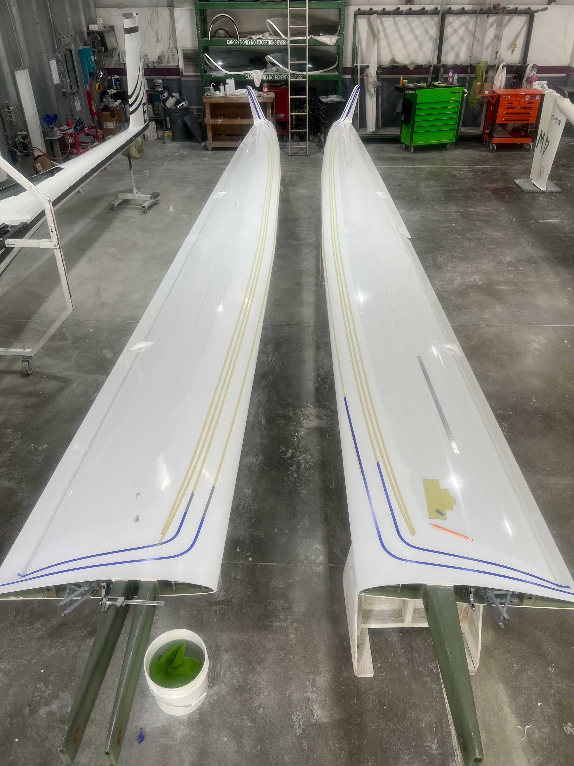A pair of white wings are sitting on a table in a garage.