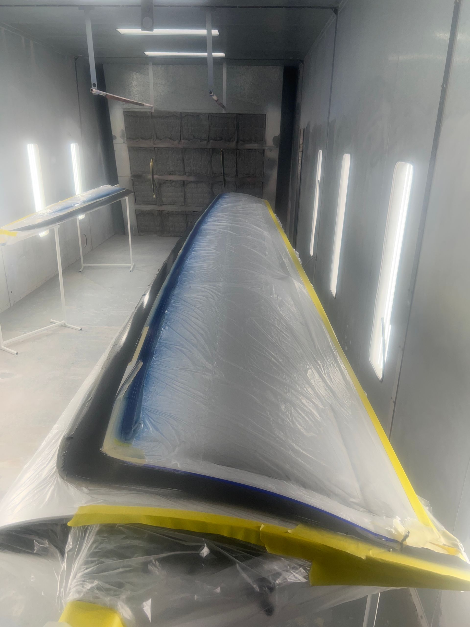 A large piece of metal is sitting on top of a table in a room.