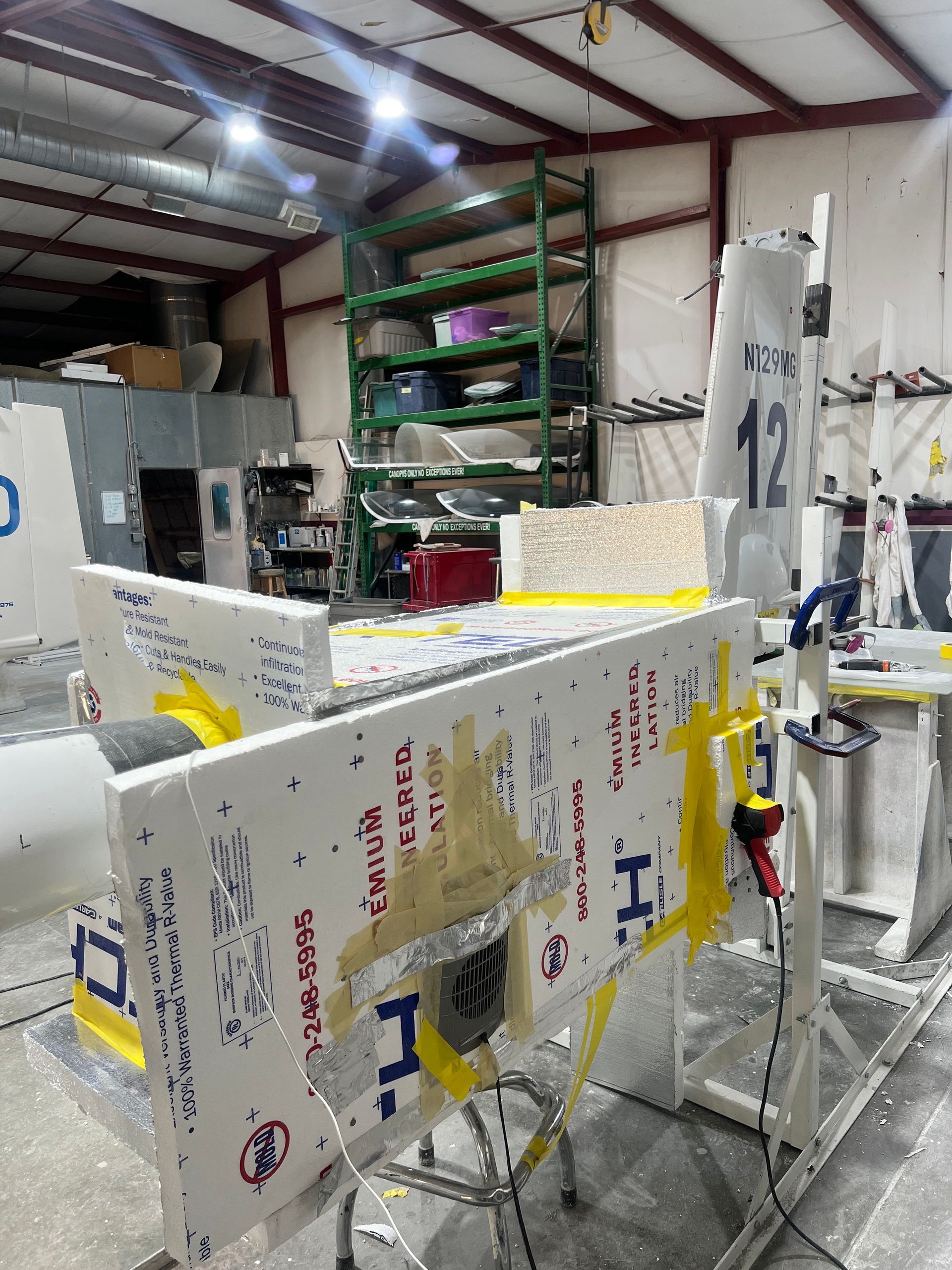 A building with a few pieces of foam on it and the number 12 on it