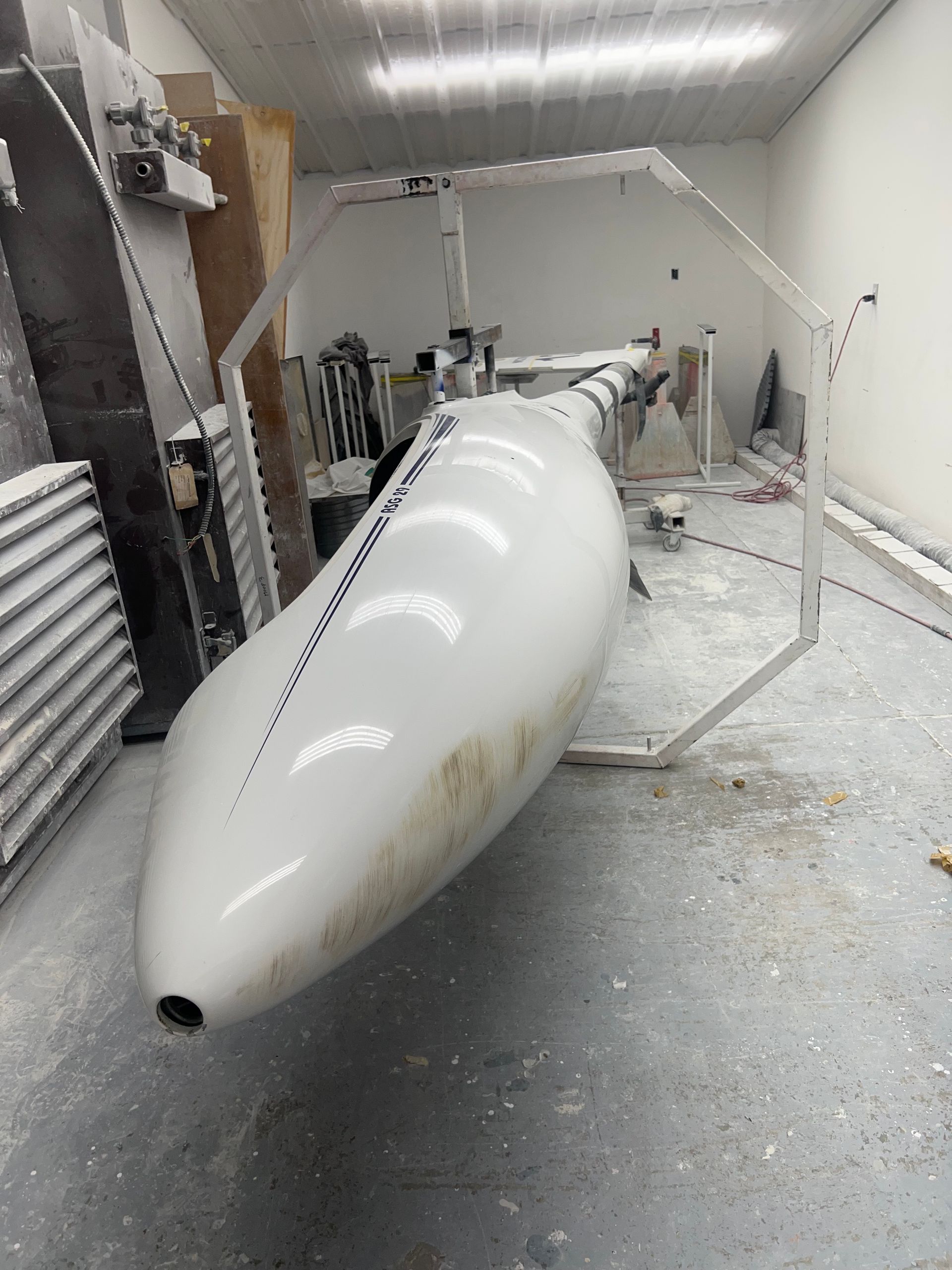 A large white object is sitting on the floor in a room