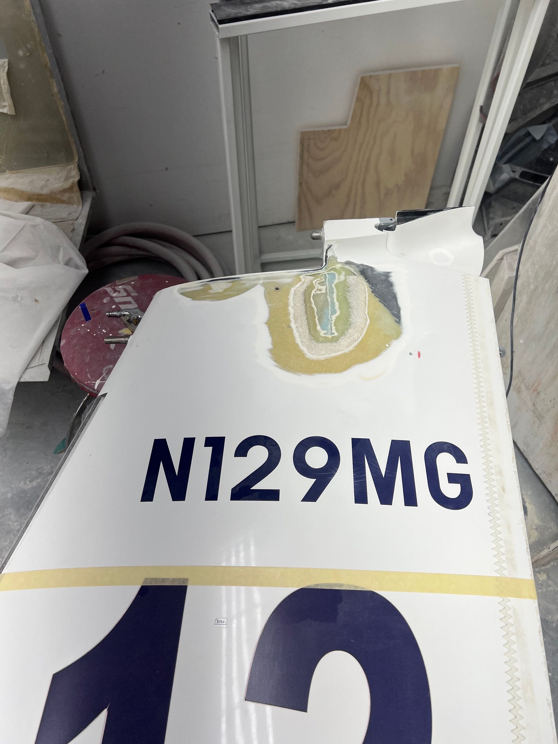 A white sign that says n129mg on it