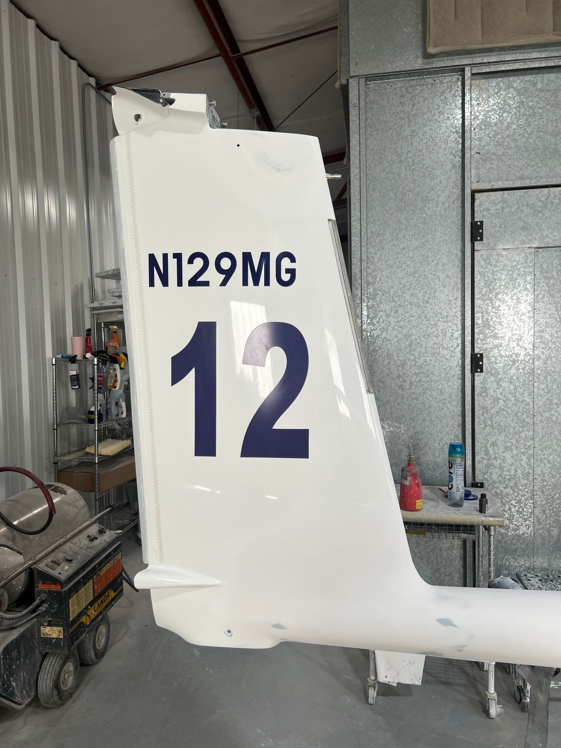 The tail of a plane with the number 12 on it