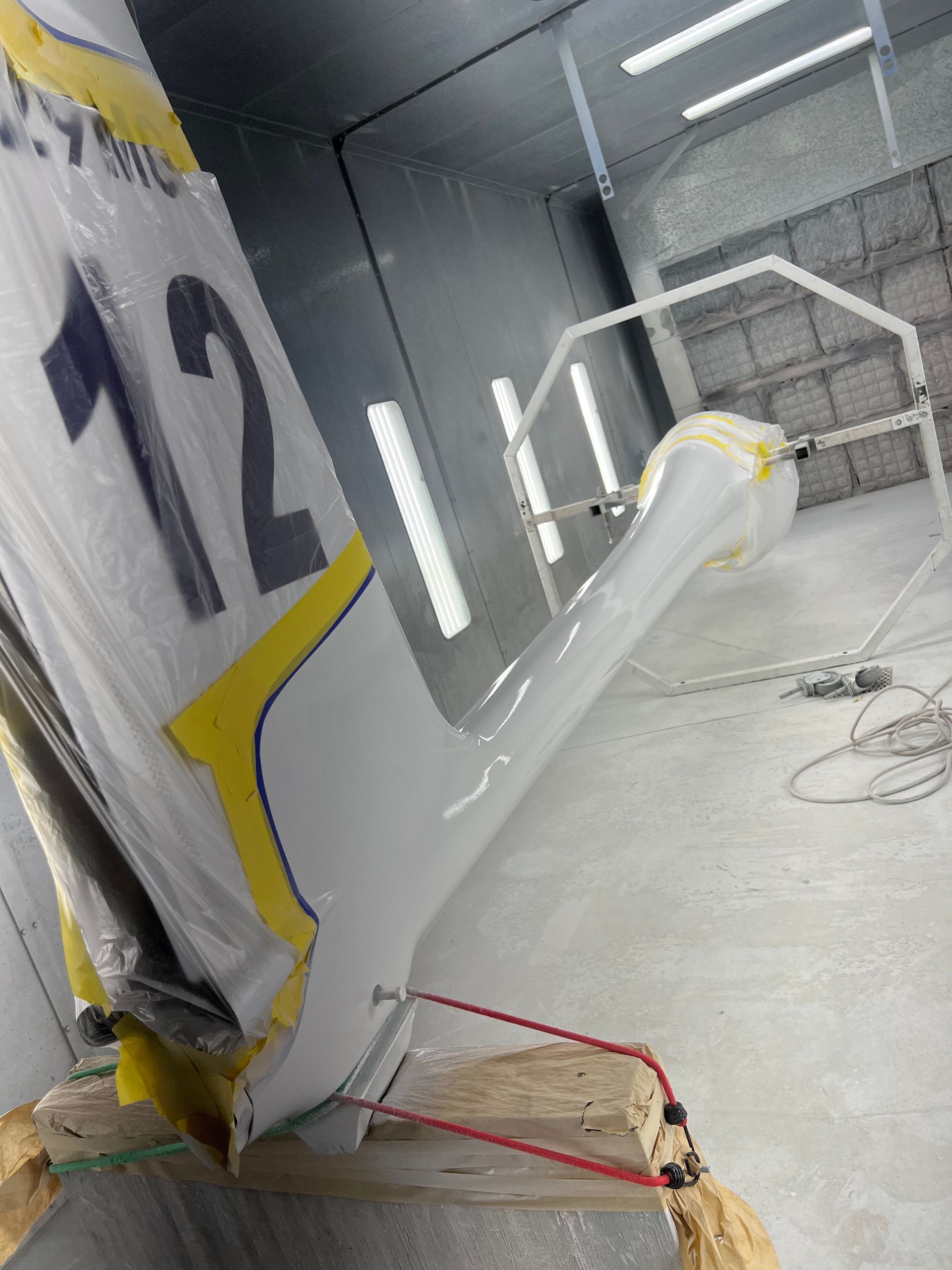 A white and yellow sign with the number 12 on it