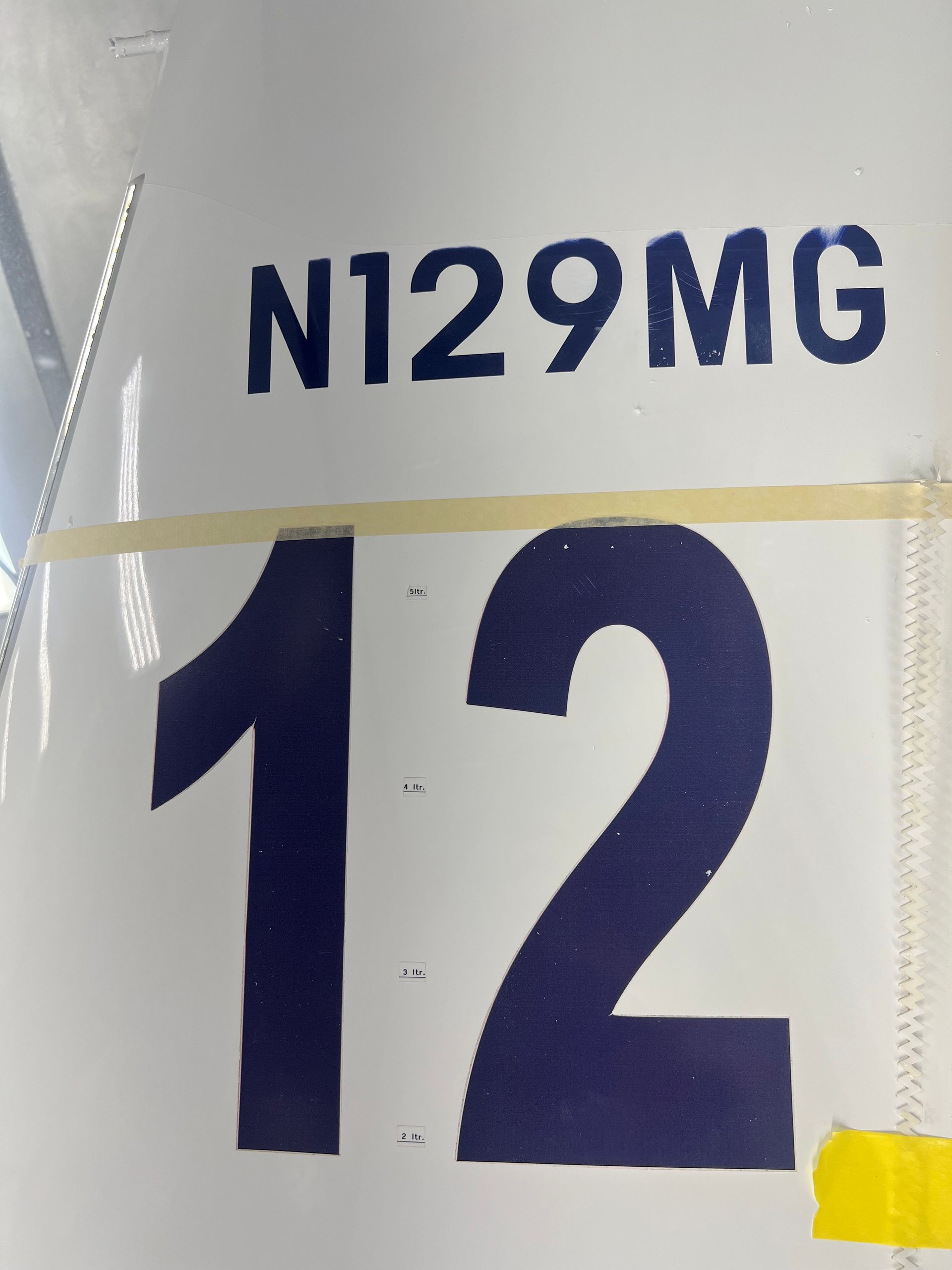 A sign that says n129mg and the number 12