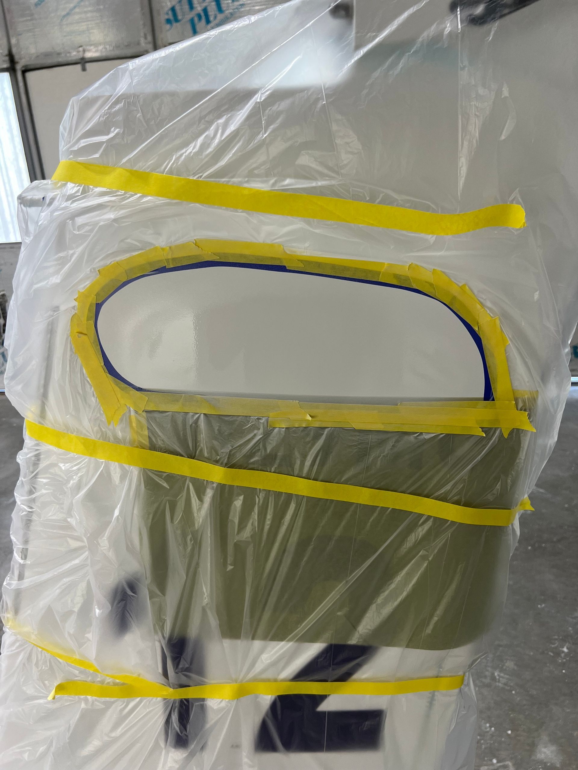 A piece of plastic is wrapped around a number 2