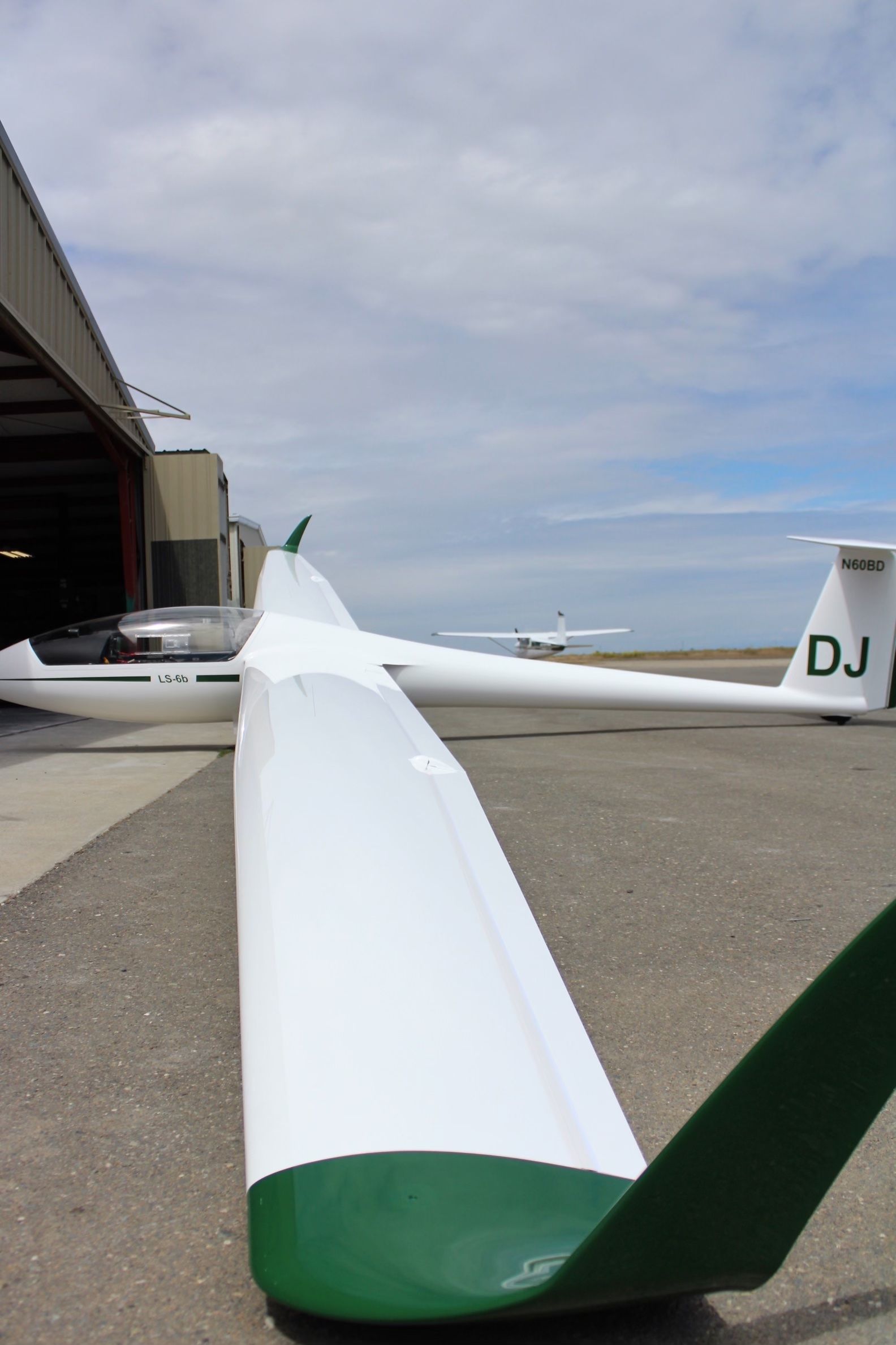 A white plane with dj written on the tail