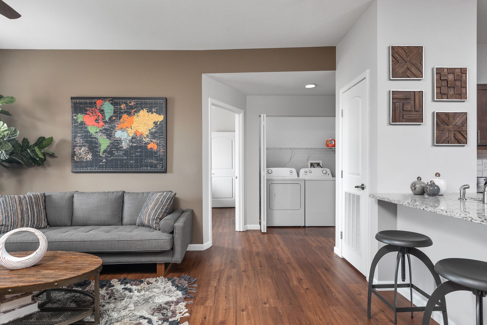 Living room with washer and dryer