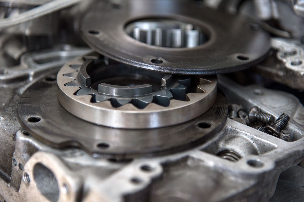 Close-up of disassembled metal engine components with gear-like parts. — Beenleigh Bearings in Beenleigh, Yatala