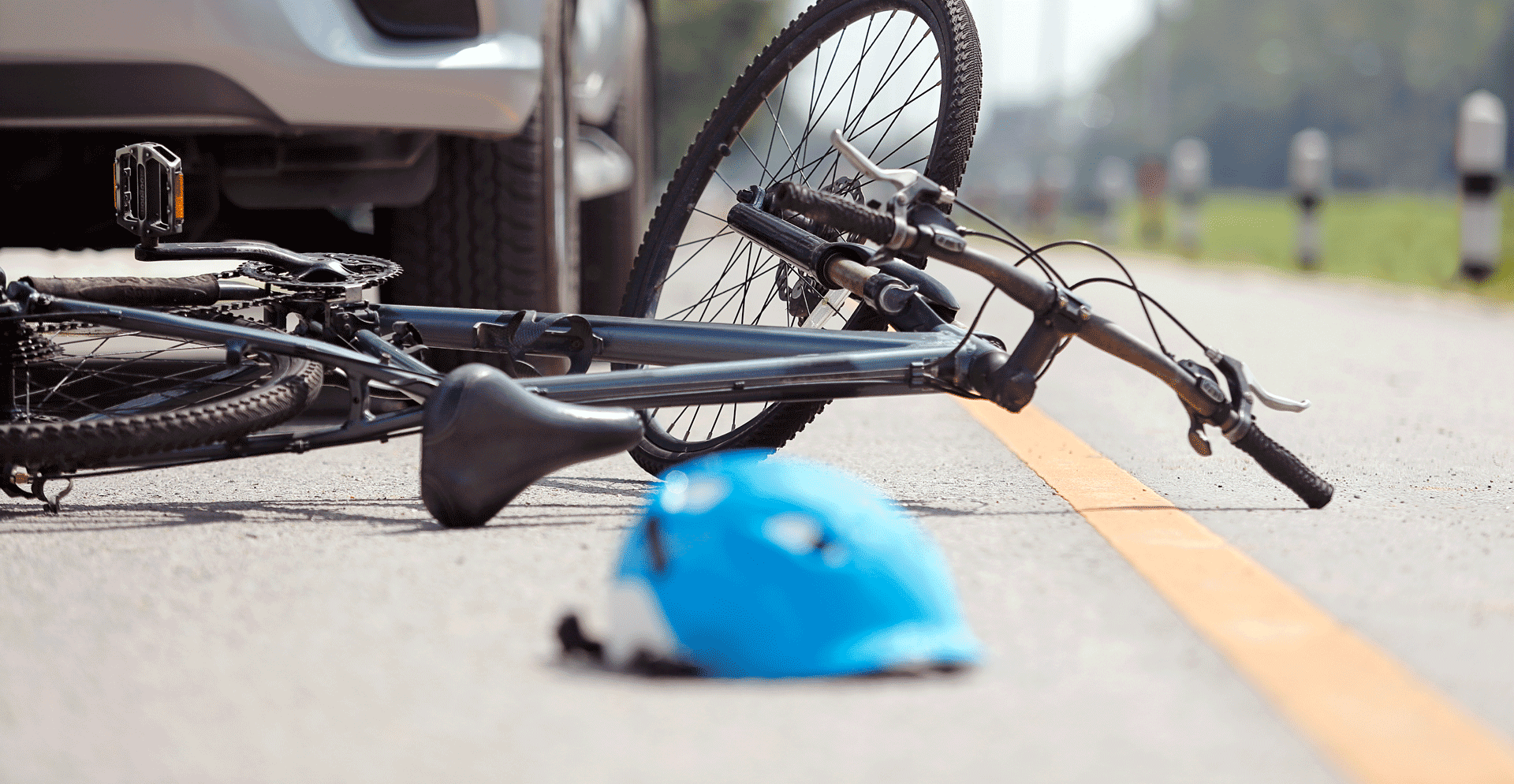Crashed bicycle and bicyclist helmet
