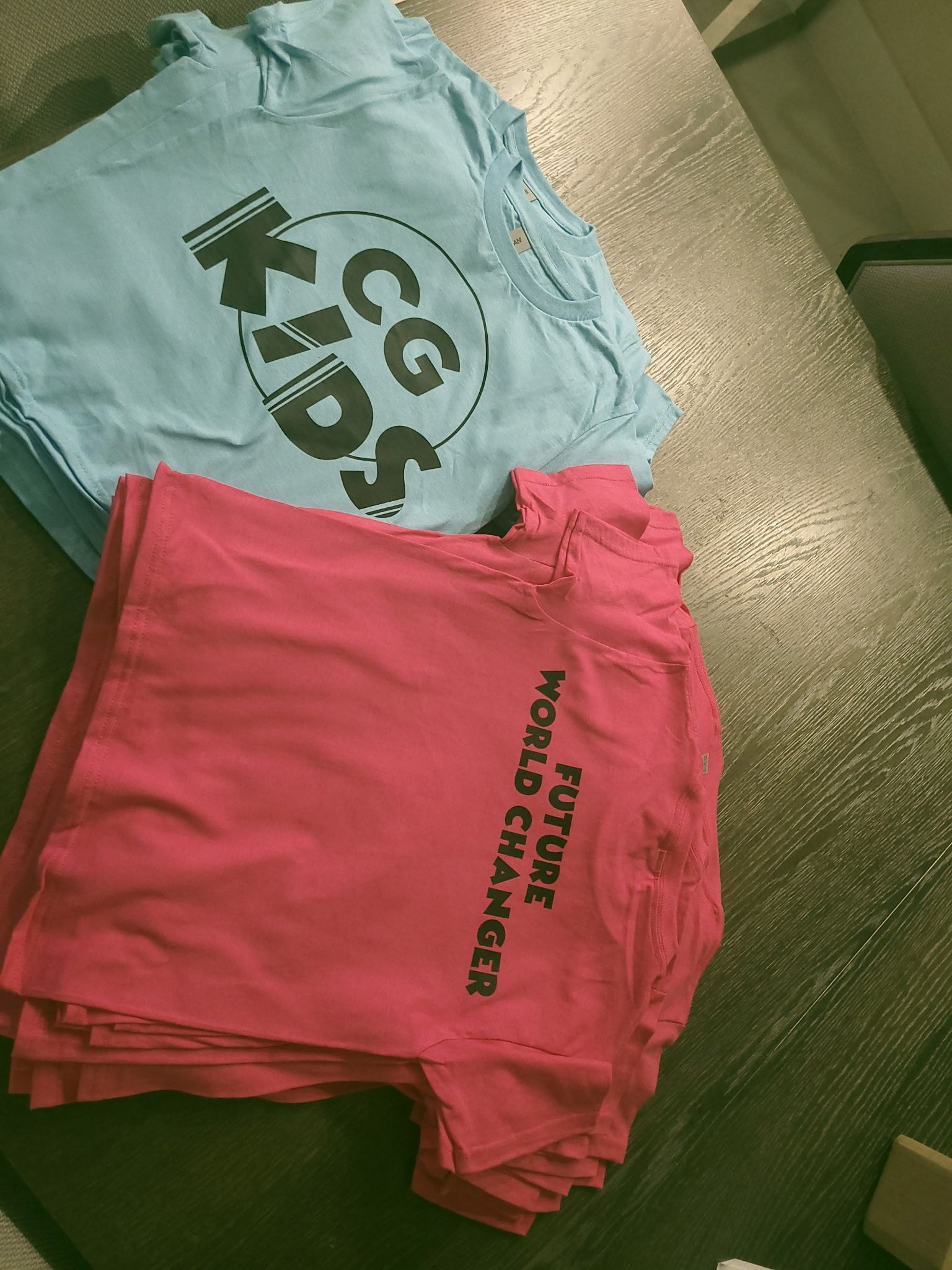 A blue t-shirt with the word kids on it