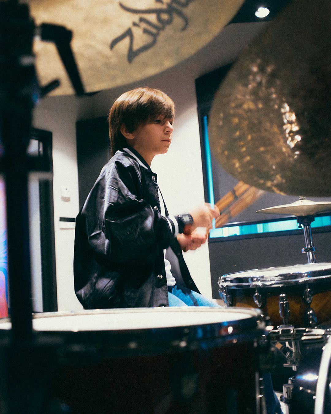 A kid during a private drum lessons in Miami, FL.