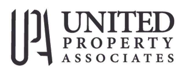 the logo for united property associates is black and white