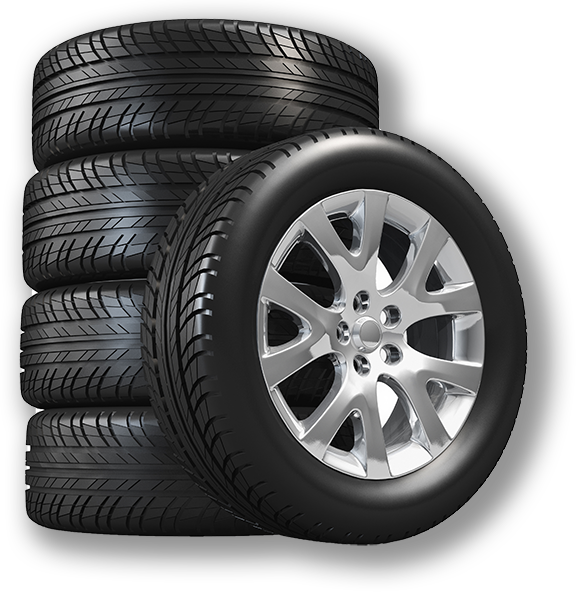 Stack of five new black tires, one mounted on a silver rim.