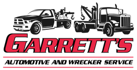 Garrett's Automotive and Wrecker Service logo: Red text over a white rectangle with tow trucks on top.