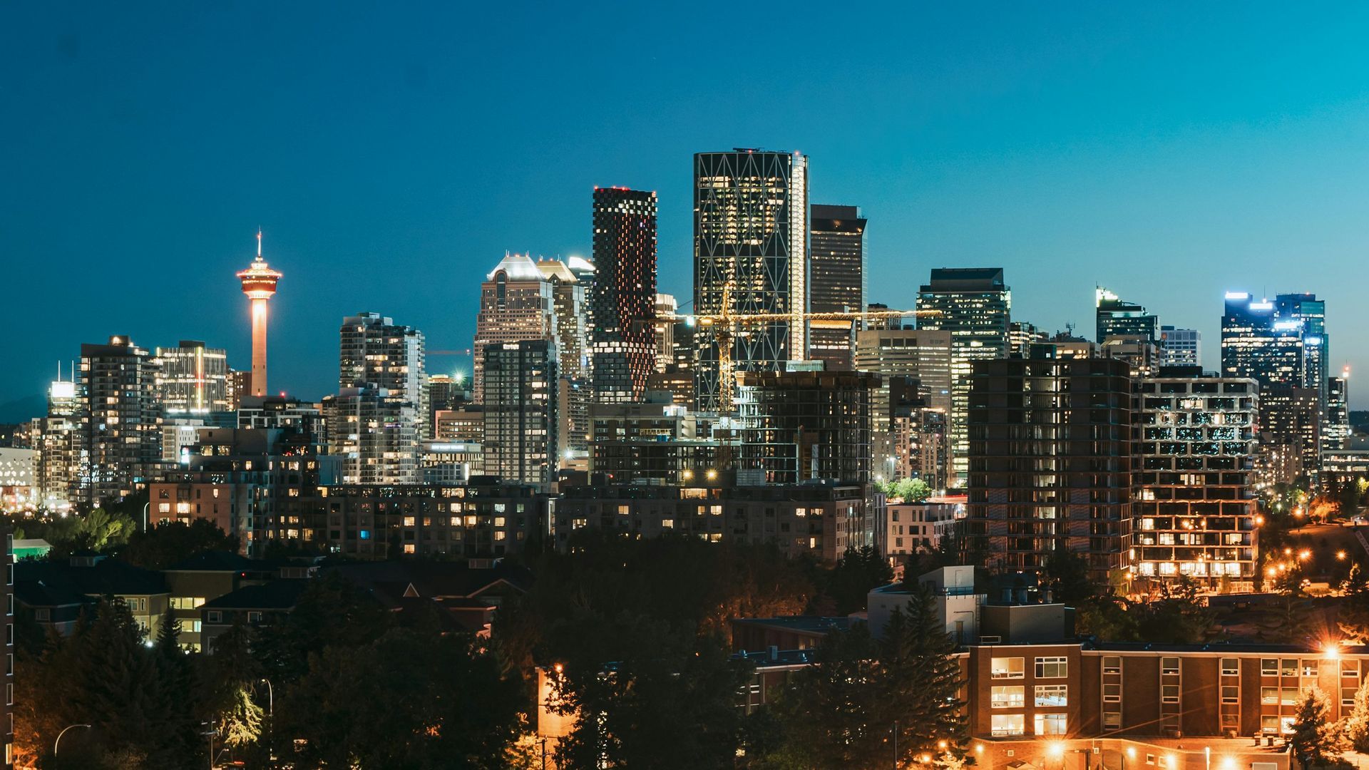 An aerial view of a city skyline at night.