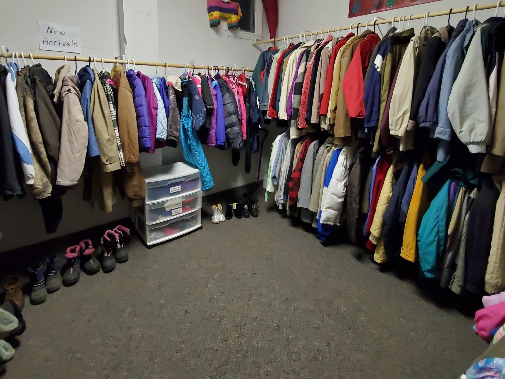 a room filled with lots of clothes and shoes.