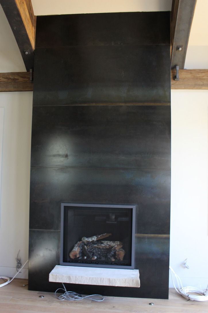 There is a fireplace in the middle of the room.