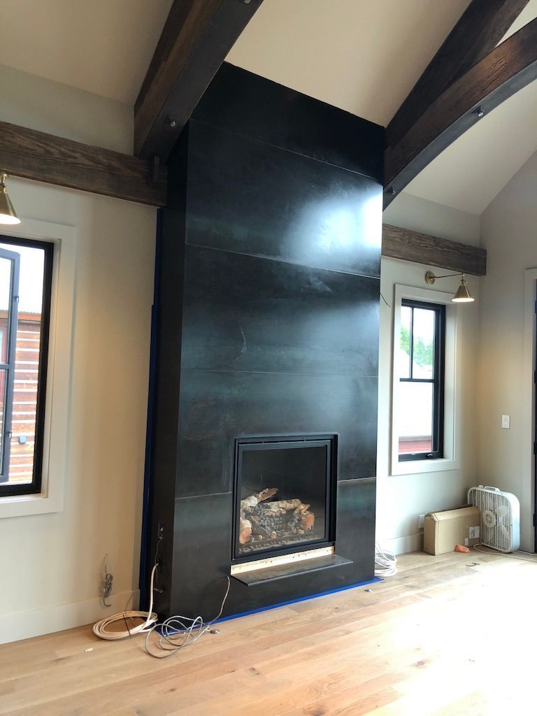 There is a fireplace in the middle of the room.