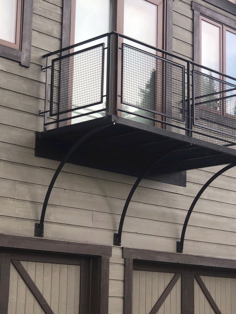 A balcony is attached to the side of a building