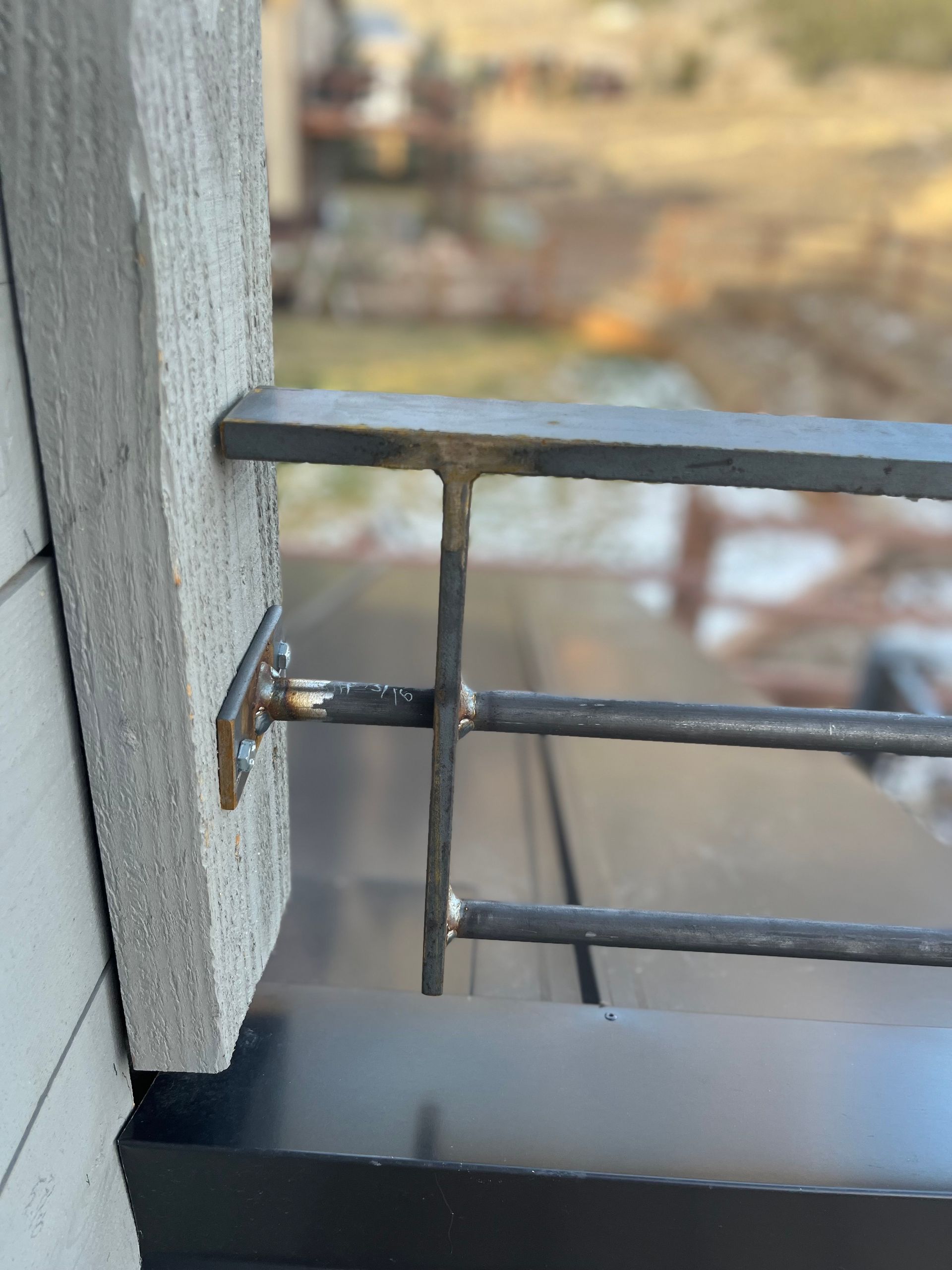 A close up of a metal railing on a balcony