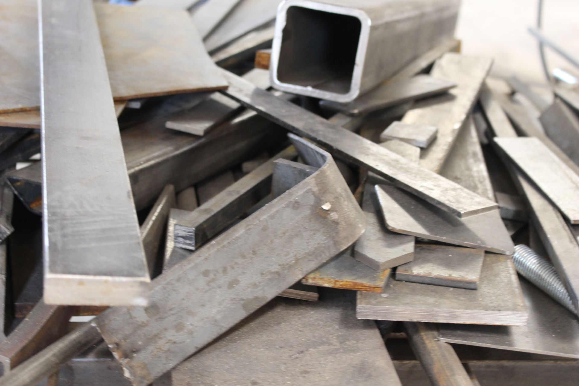 A pile of metal scraps with a square in the middle