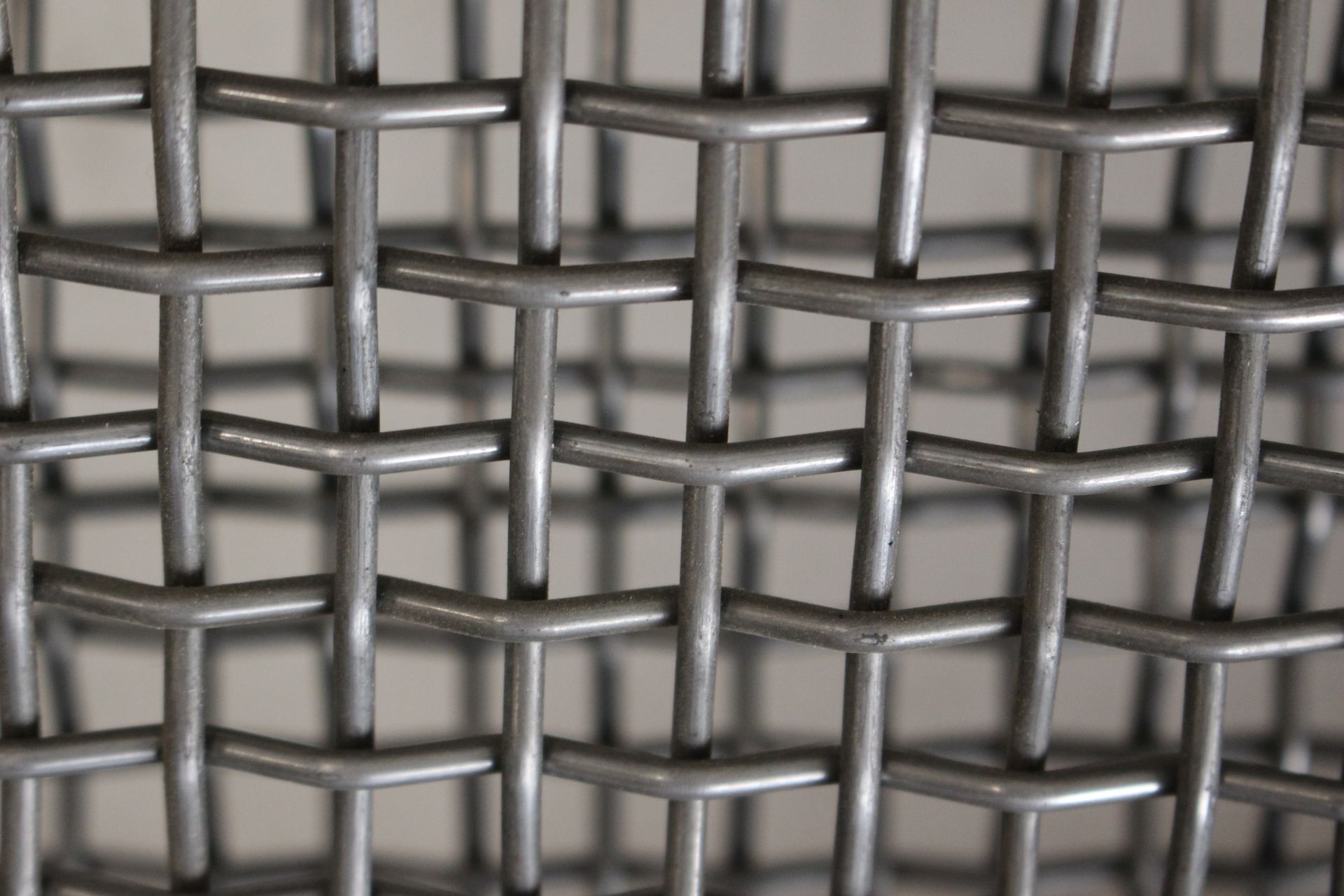 A close up of a metal wire mesh on a table.