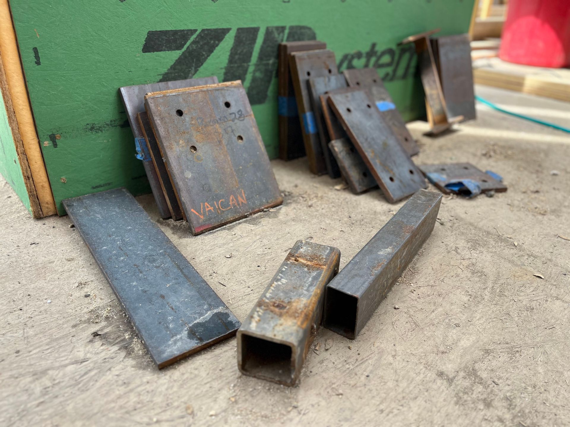 A bunch of metal pieces are laying on the ground