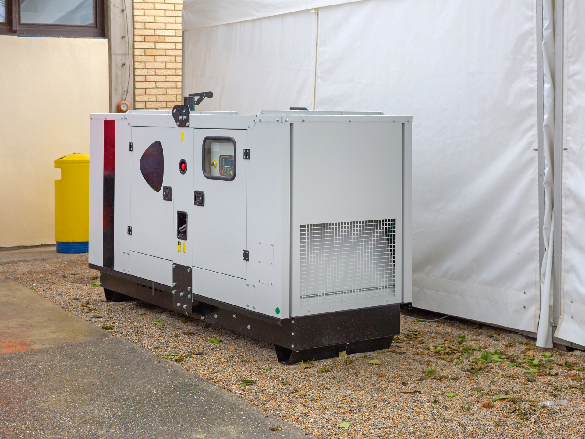 Commercial backup generator installed outdoors for reliable emergency power supply.
