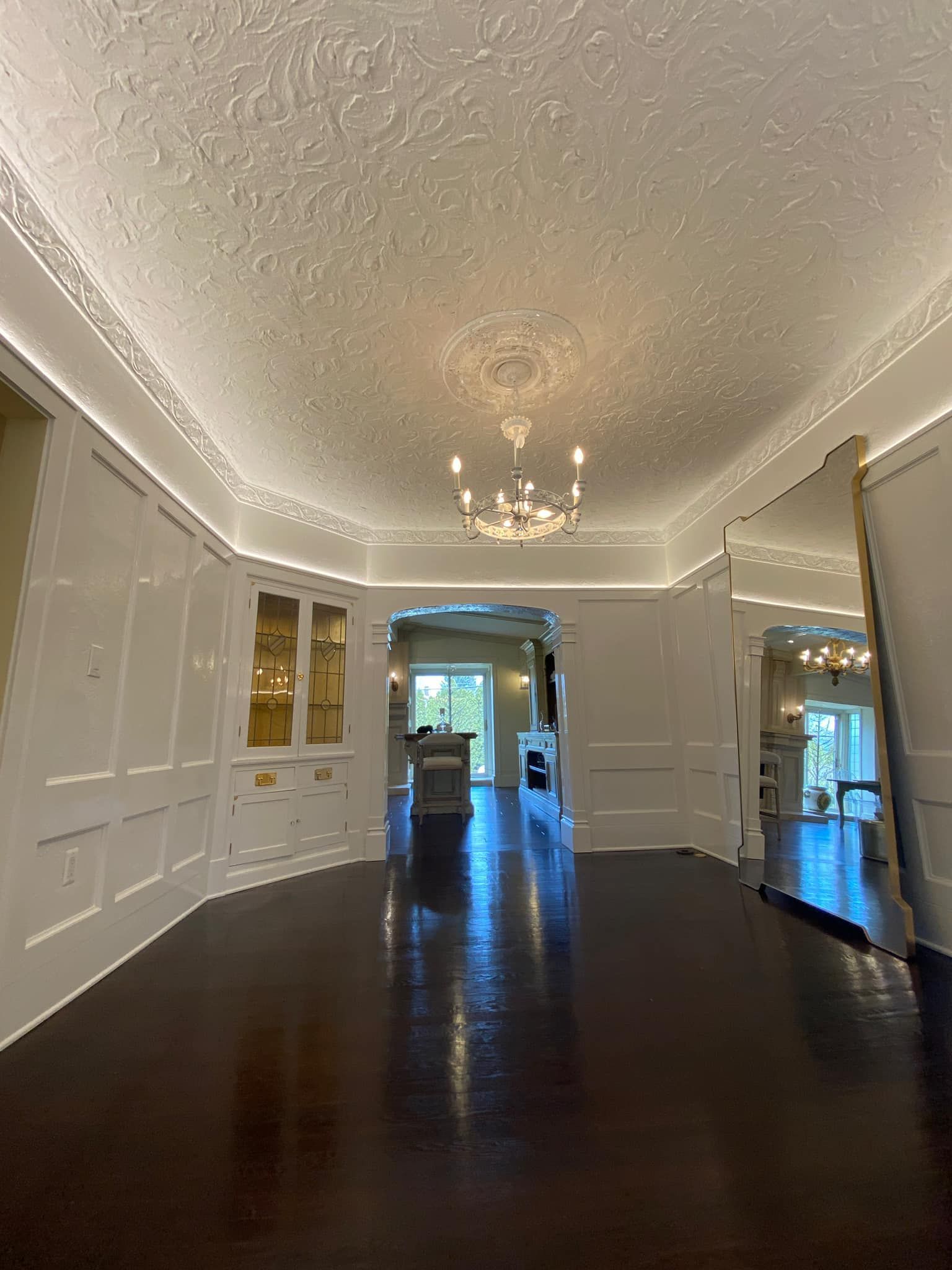 Dining room chandelier installation with ceiling lighting upgrade
