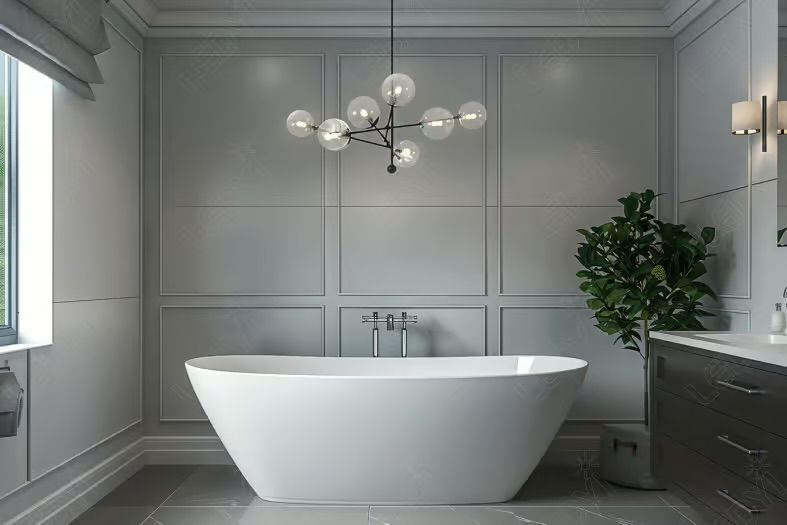Modern bathroom with white tub, grey paneled wall, and spherical chandelier.