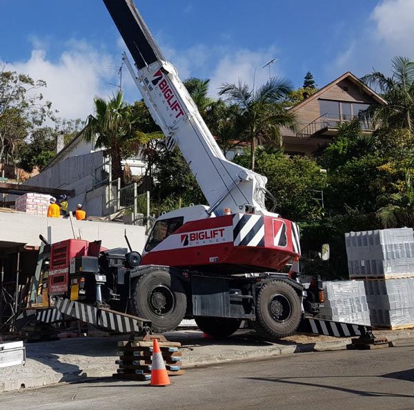 A biglift crane is parked on the side of the road