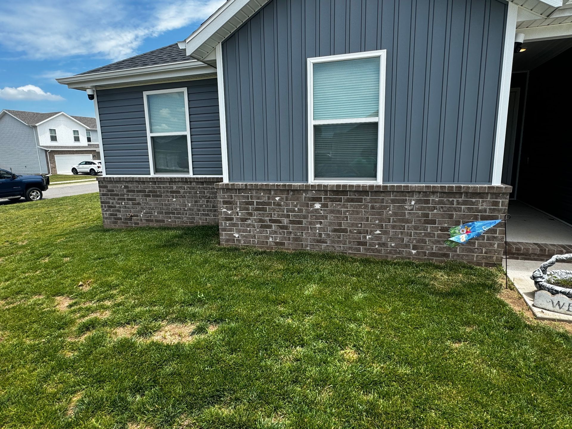 A house with a lot of grass in front of it