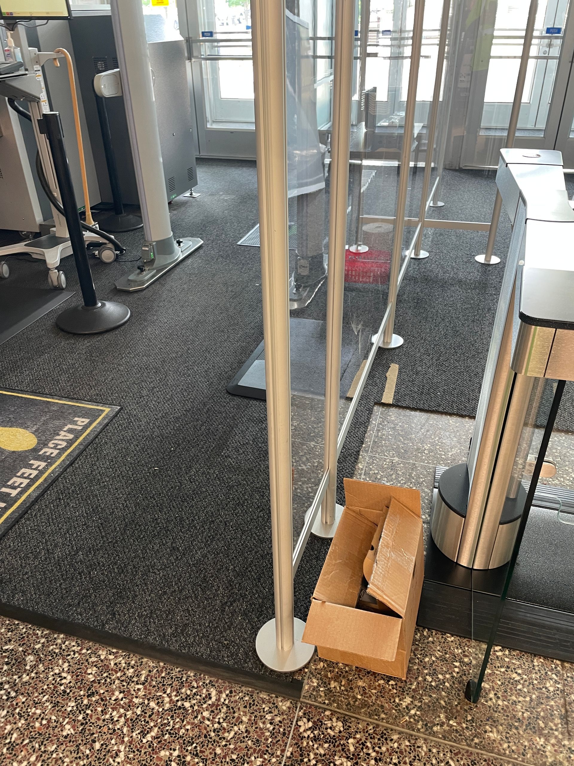 Security line with stanchions and clear dividers. 