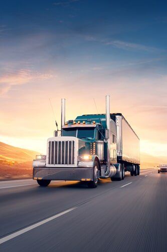 Truck on road — Freight Services in Gracemere, QLD