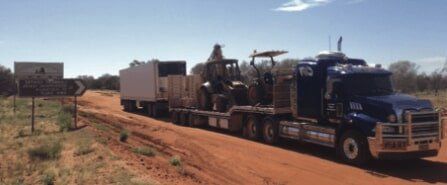 Blue truck with cargo on back — Freight Services in Gracemere, QLD