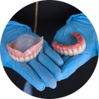 Dentist Holding Teeth | Dentures and Dental Implants | Alexandria VA